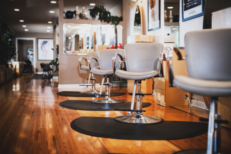 Modern hair styling chairs in a bright salon setting at New Moon Spa, Eureka Springs AR.